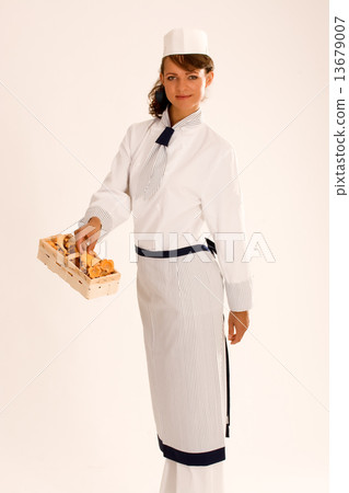 female chef with chanterelles and apron 13679007