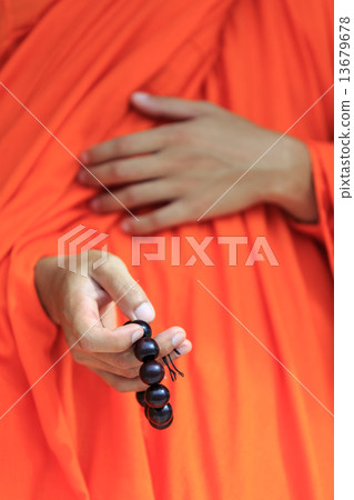 prayer beads in monk's hand prayer beads in monk's hand 13679678