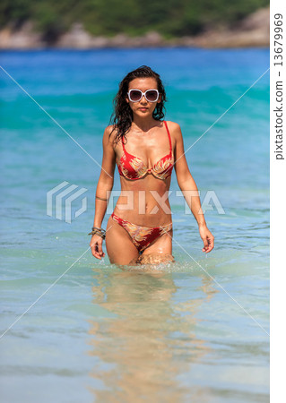 woman going for a swim in Thailand waters 13679969