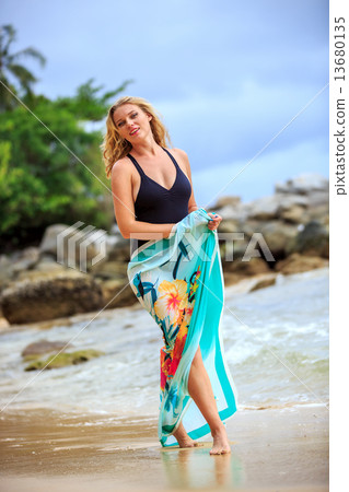 Blonde Woman Posing at the beach Blonde Woman Posing at the beach 13680135