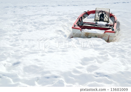 boat in the winter on shore 13681009