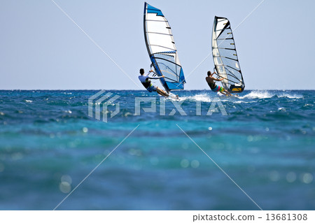 Two windsurfers in action 13681308
