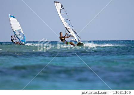 Two windsurfers in action 13681309