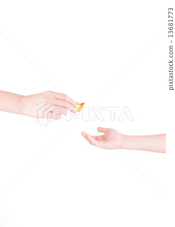 Adult's Hand Giving A Chinese Gold Isolated On White Background 13681773