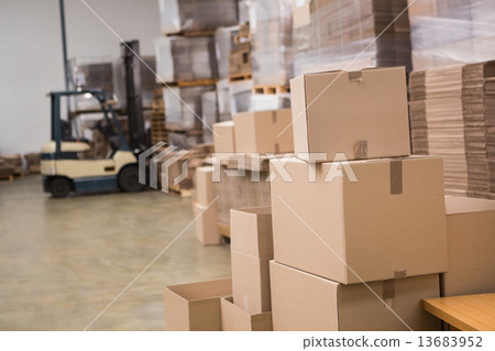 Forklift in a large warehouse Forklift in a large warehouse 13683952