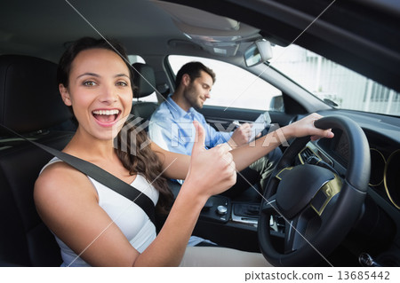 Young woman getting a driving lesson 13685442