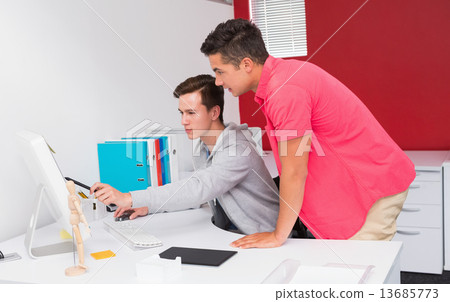 Stock Photo: Students working together on computer