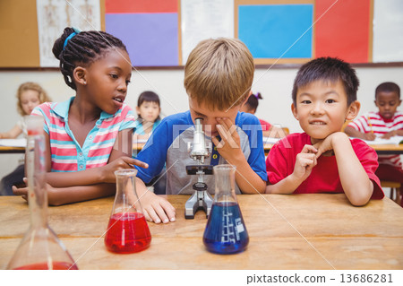 Cute pupil looking through microscope Cute pupil looking through microscope 13686281