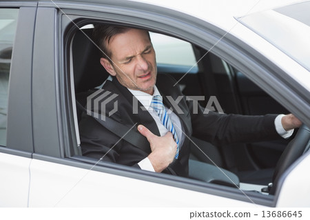 Businessman suffering from heartache 13686645
