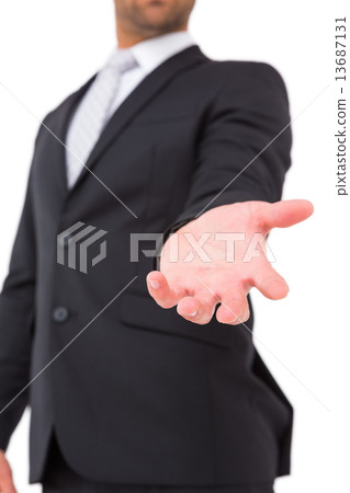 Businessman holding out his hand Businessman holding out his hand 13687131