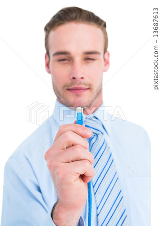 Smiling businessman in shirt holding a cable 13687613