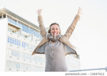 Happy blonde standing and cheering Happy blonde standing and cheering 13687812