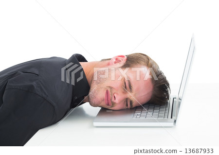 Tired businessman resting on laptop 13687933
