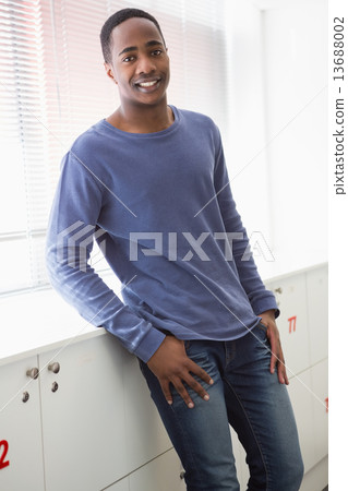 Smiling university student standing and posing 13688002