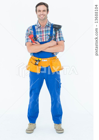 Confident plumber holding monkey wrench and plunger 13688104