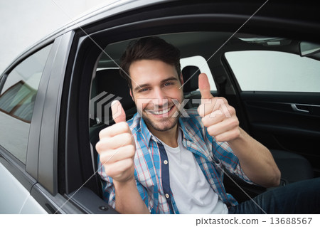 Young man smiling at camera Young man smiling at camera 13688567