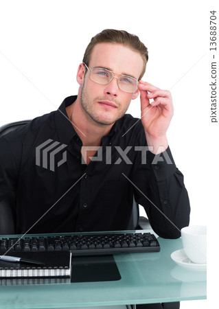 Thoughtful businessman working at his desk Thoughtful businessman working at his desk 13688704