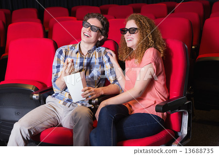 Young couple watching a 3d film 13688735