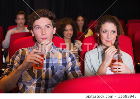 Young couple watching a film 13688945