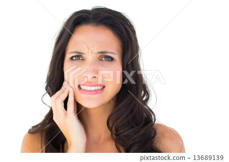 Pretty brunette with a toothache Pretty brunette with a toothache 13689139