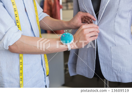 Fashion student working on mannequin 13689519