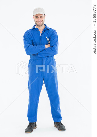 Male mechanic standing arms crossed on white background 13689778