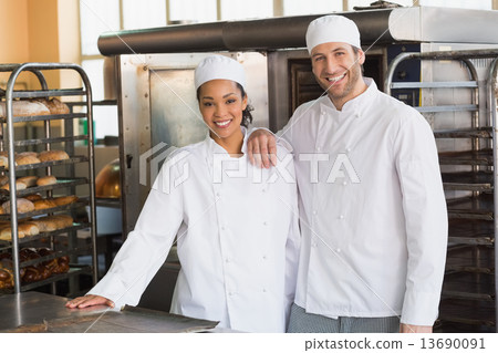 Team of bakers smiling at camera 13690091