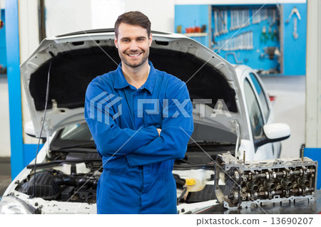 Smiling mechanic looking at camera Smiling mechanic looking at camera 13690207