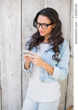 Pretty hipster sending a text 13690310