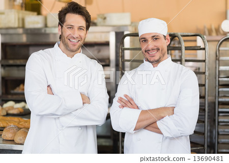 Smiling bakers looking at camera Smiling bakers looking at camera 13690481