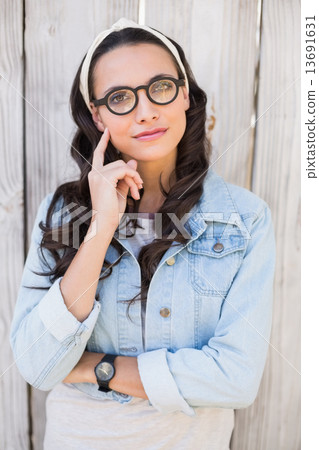 Pretty hipster thinking and smiling Pretty hipster thinking and smiling 13691631