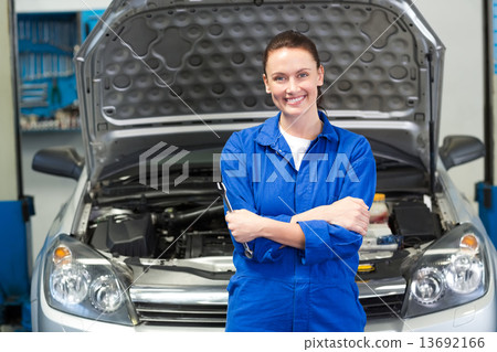 Mechanic smiling at the camera Mechanic smiling at the camera 13692166