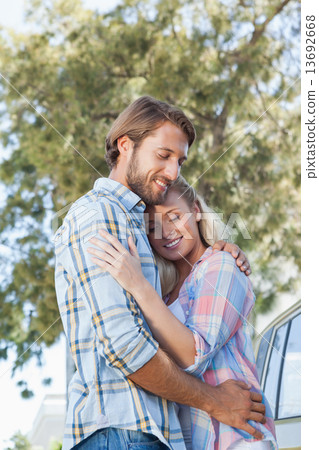 Cute couple standing and hugging Cute couple standing and hugging 13692668