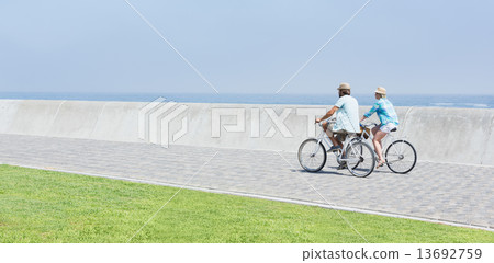 Cute couple on a bike ride 13692759
