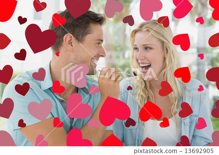 Composite image of cute valentines couple Composite image of cute valentines couple 13692905