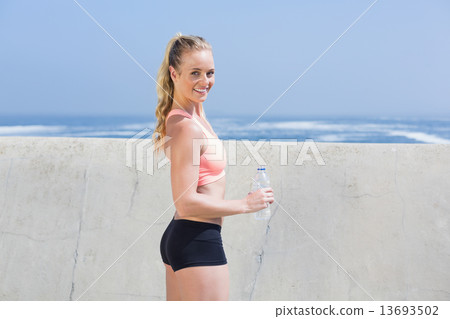 Fit blonde holding water bottle Fit blonde holding water bottle 13693502