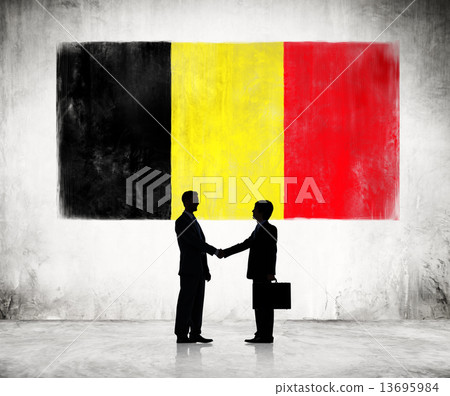 Two Businessmen Shaking Hands On A Background With National Flag Two Businessmen Shaking Hands On A Background With National Flag 13695984