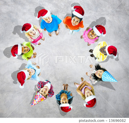 Kids with christmas hats in grey background Kids with christmas hats in grey background 13696082