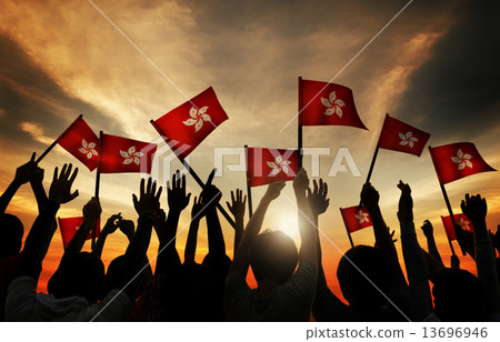 Silhouettes of People Holding the Flag of Hong Kong Silhouettes of People Holding the Flag of Hong Kong 13696946