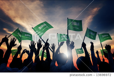 Silhouettes of People Holding Flag of Saudi Arabia Silhouettes of People Holding Flag of Saudi Arabia 13696972