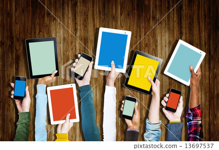Group of Hands Holding Digital Devices Group of Hands Holding Digital Devices 13697537