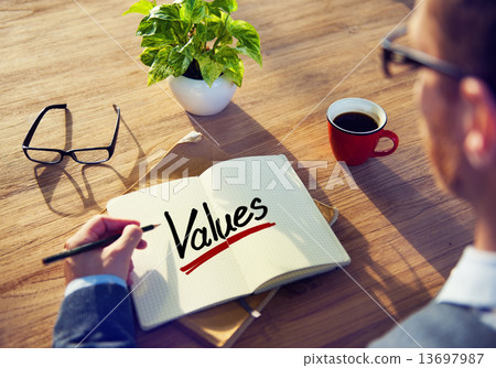 Man with a Note and a Single Word Values 13697987