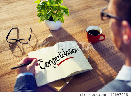 Man with a Note and a Single Word Congratulation 13697998