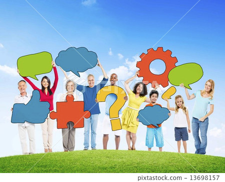 Diverse People Holding Symbols On a Hill Diverse People Holding Symbols On a Hill 13698157