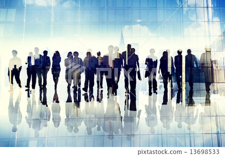 Silhouettes of Business People in an Urban Scene 13698533