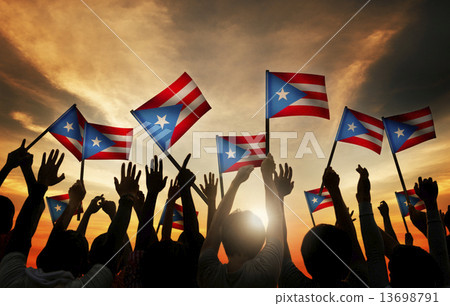 Group of People Waving Flag of Puerto Rico in Back Lit 13698791