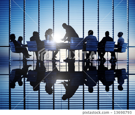 Silhouettes Of Business People In A Conference Room Silhouettes Of Business People In A Conference Room 13698793