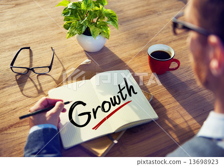Businessman with Note About Growth Concepts 13698923