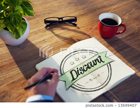 Businessman Writing the Word "Discount" 13699407