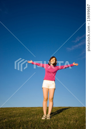Young Woman With Her Arms Raised 13699667